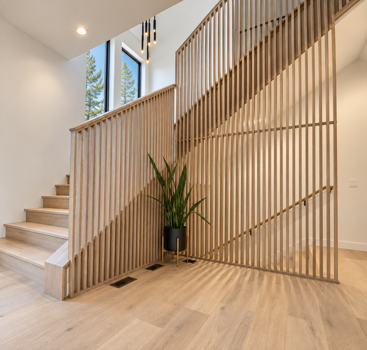 Light wood entry staircase with a slat railing